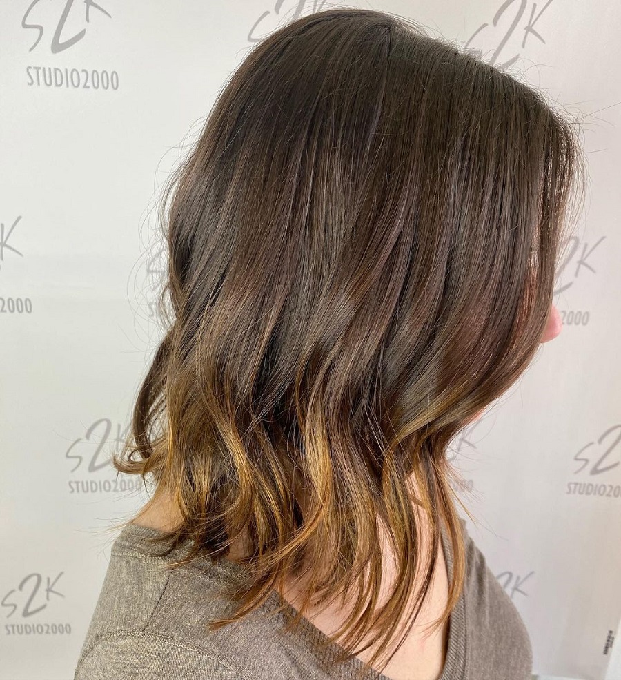 long inverted bob with blonde highlights