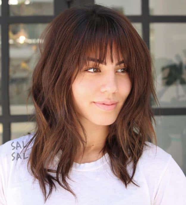 Medium Layered Hairstyle With Bangs