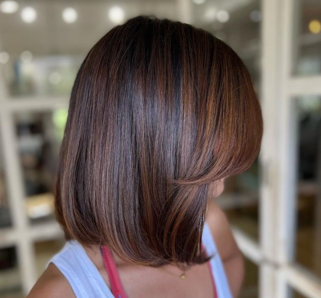 Medium Length Hair with Brown Highlights and Long Side Bangs