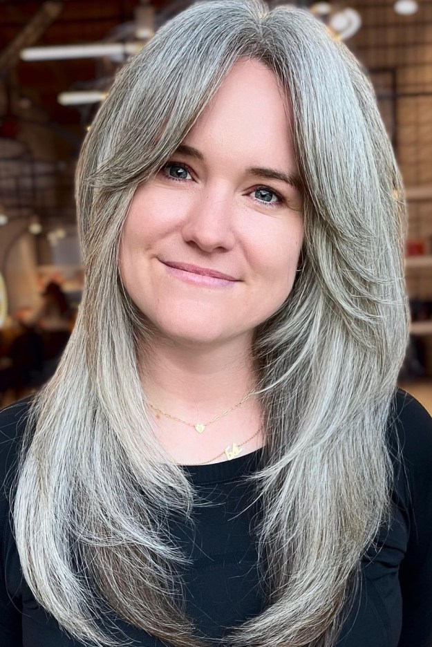 Middle Aged Woman with Thick Long Gray Layered Hair
