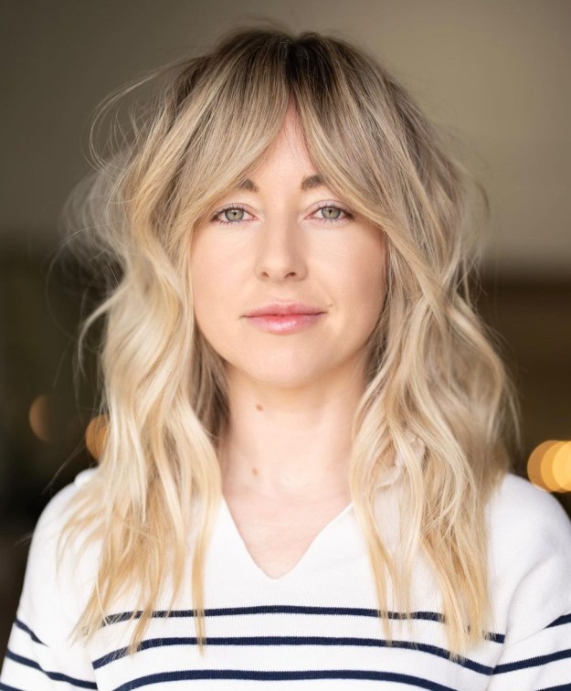 Middle Length Shaggy Blonde Hairstyle with Dark Roots