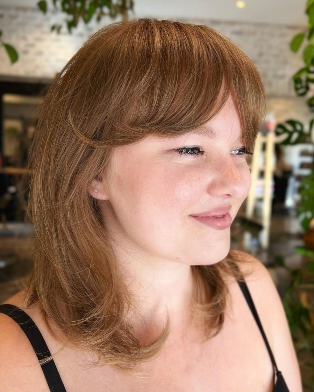 Modern Rathel Cut with Curtain Bangs for Round Faces