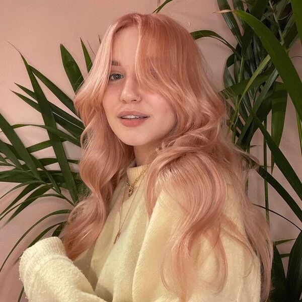 Pastel Peachy Hair - a woman wearing a yellow longsleeve