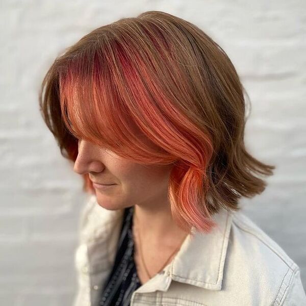 Peachy Peekaboo Hairstyle - a woman wearing a white denim jacket