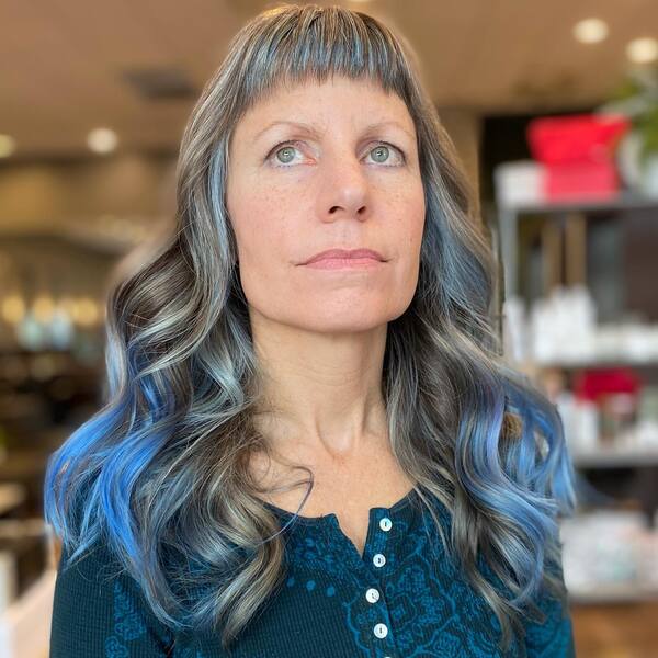 Periwinkle Light Blue Hair - a woman wearing a blue longsleeve blouse