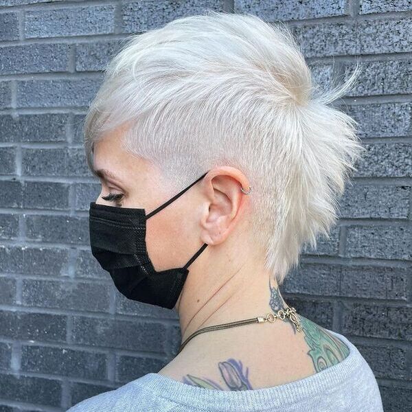 Platinum Edgy Fauxhawk Pixie - a woman wearing gray shirt with black mask