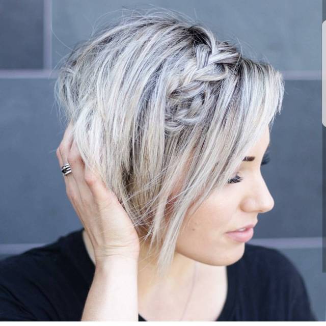 Sleek pixie cut with blunt bangs for heart-shaped faces