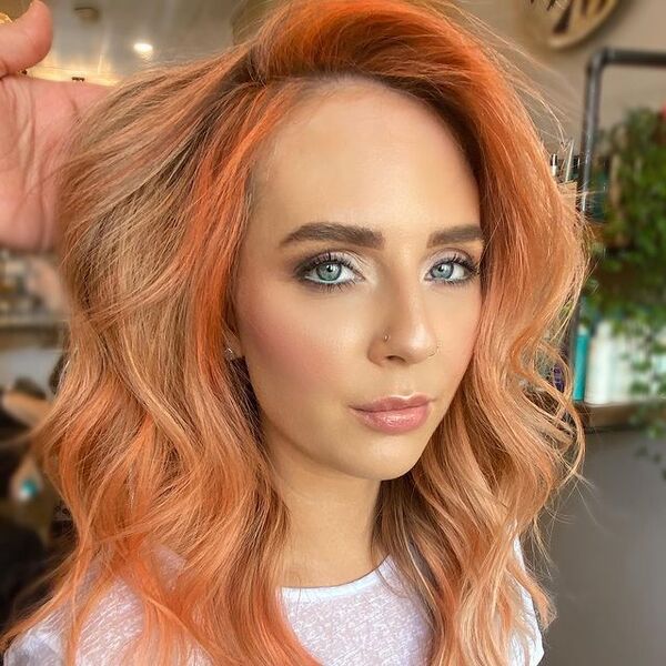 Side-Parted Peach Blonde Hair - a woman wearing a white blouse