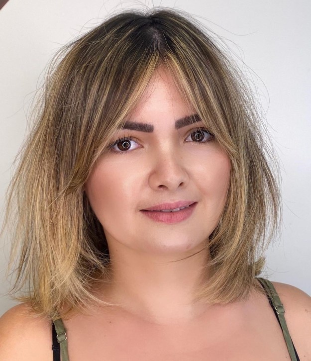 Soft Blonde Balayage and Curtain Bangs Hairstyle