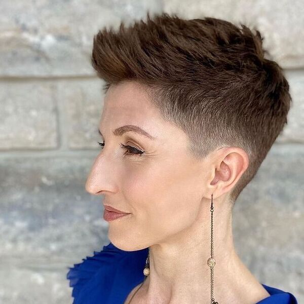 Spiky Fade Edgy Pixie - a woman wearing blue blouse