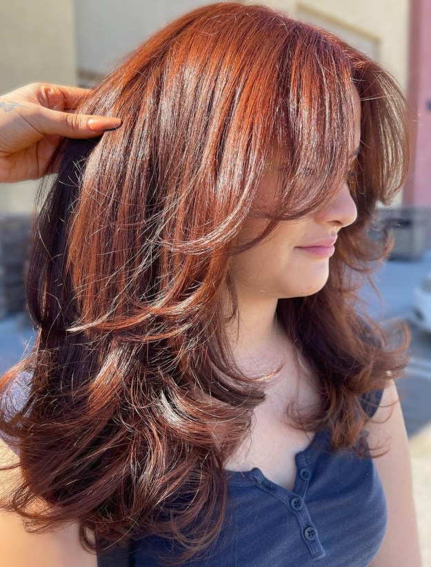 Thick Red Brown Hair with Curtain Bangs and Layers