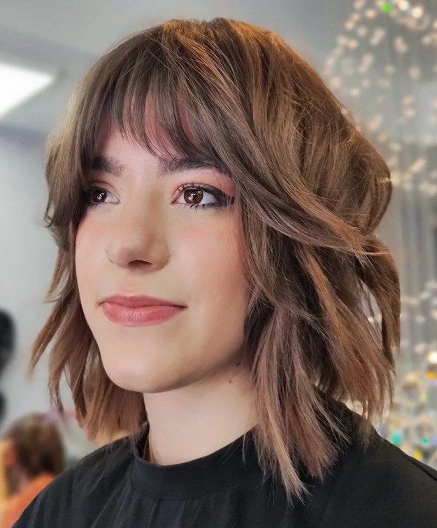 Tousled Bob with Arched Bangs and Framing Layers
