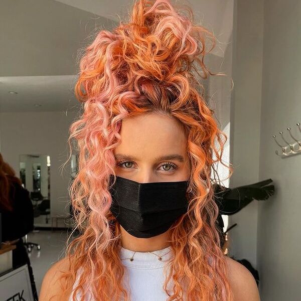 Two-Toned Peachy Hair with Curls - a woman wearing a black facemask