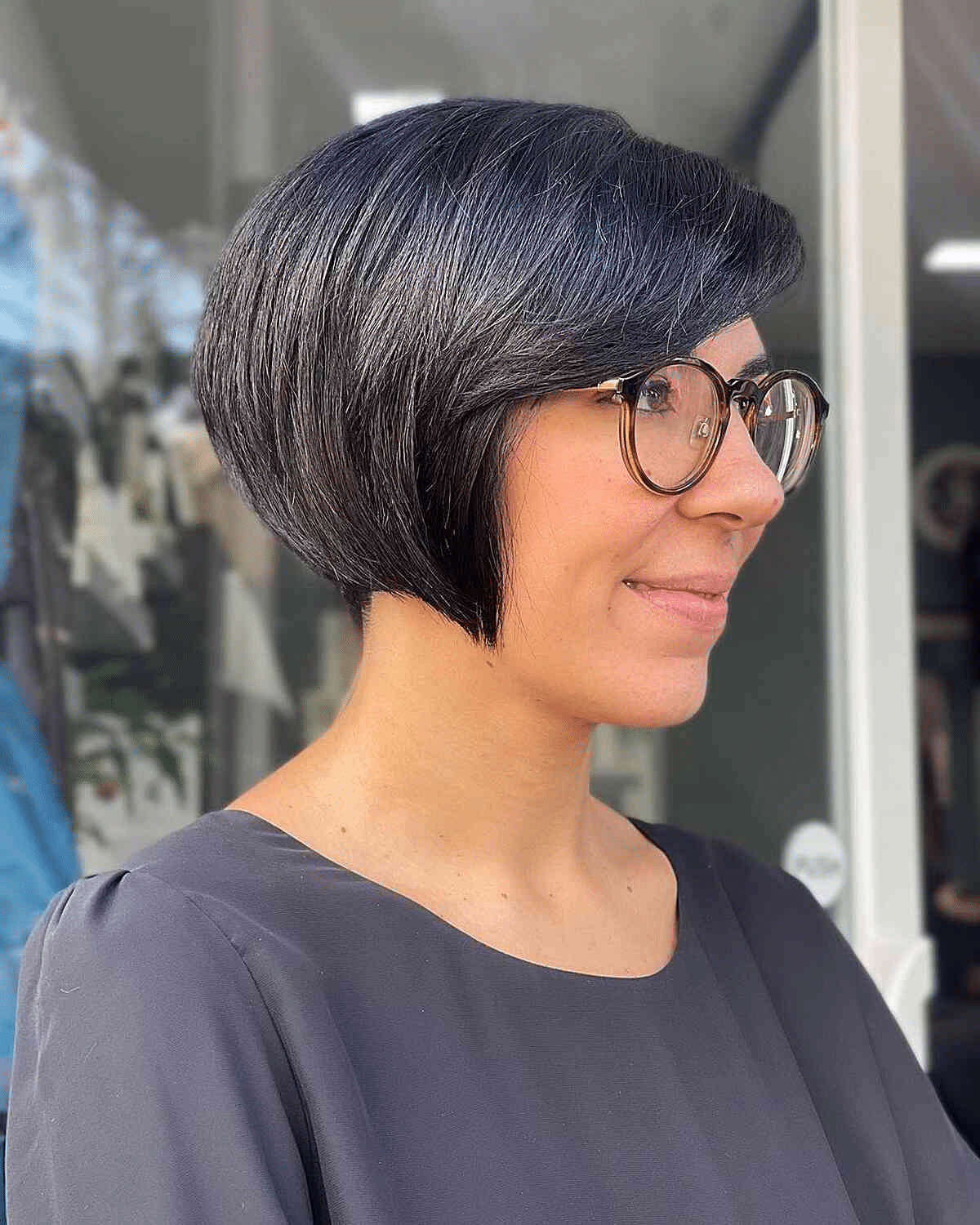 Round Short Black Bob with Side-Swept Bangs