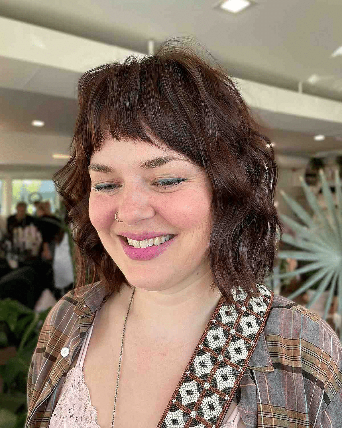 Short-Arched Bangs with Brunette Wavy Bob