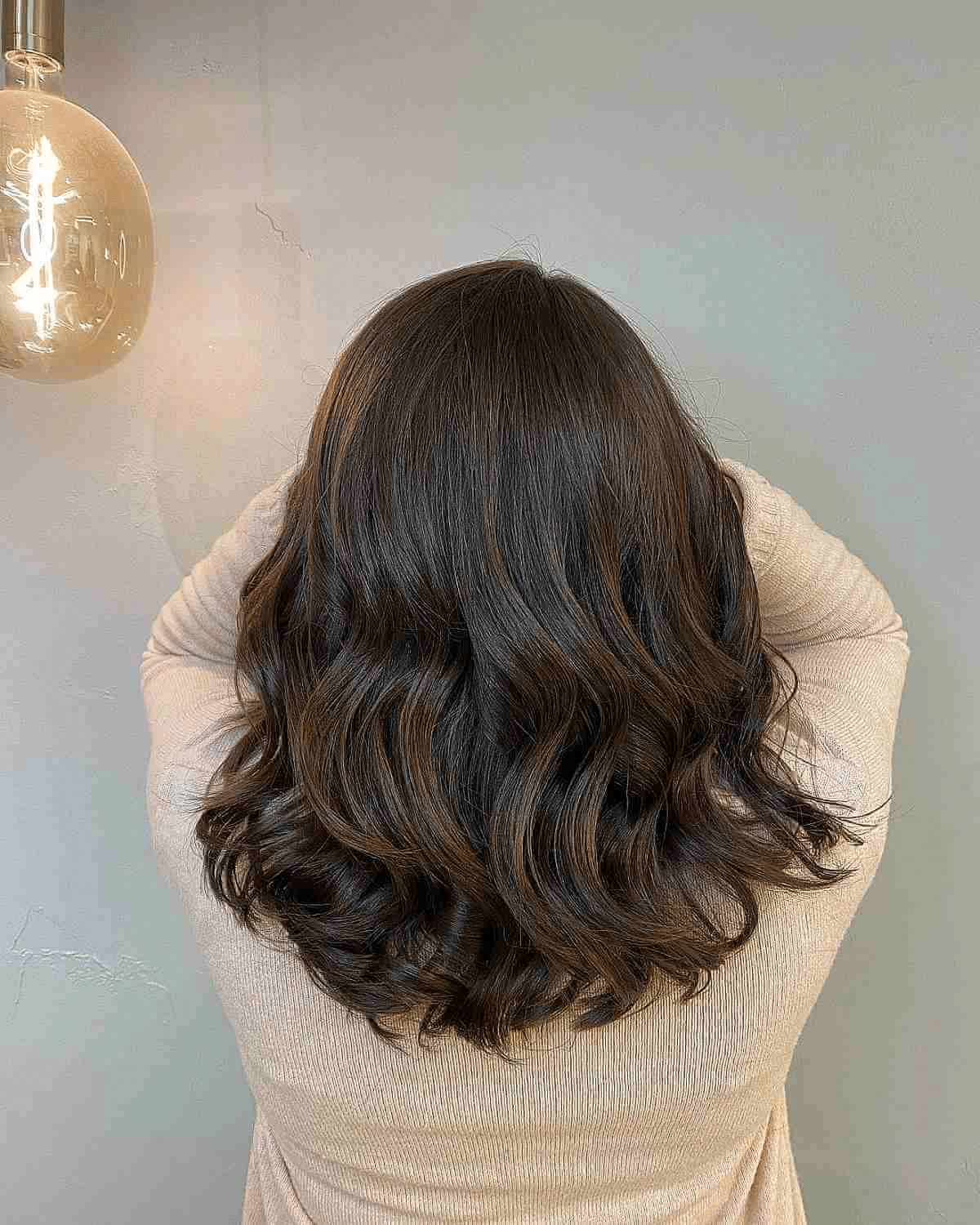 Subtle Sun-Kissed Highlights on Brunette Hair