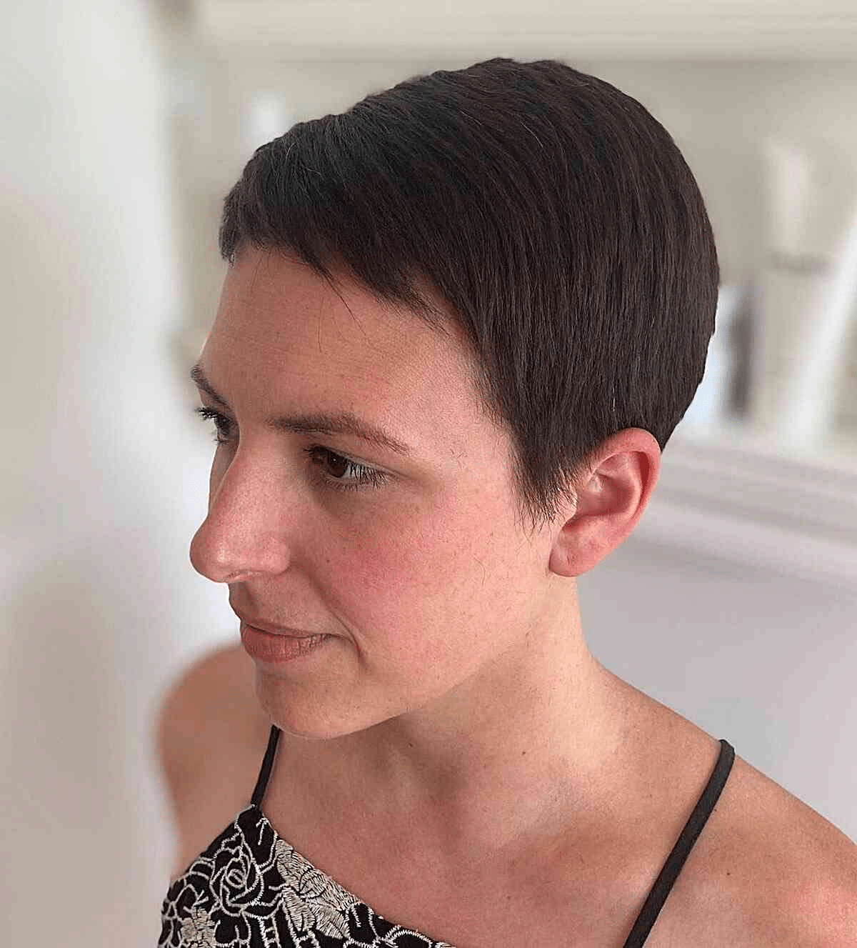 Very Short and Sleek Pixie on Dark Hair Tone