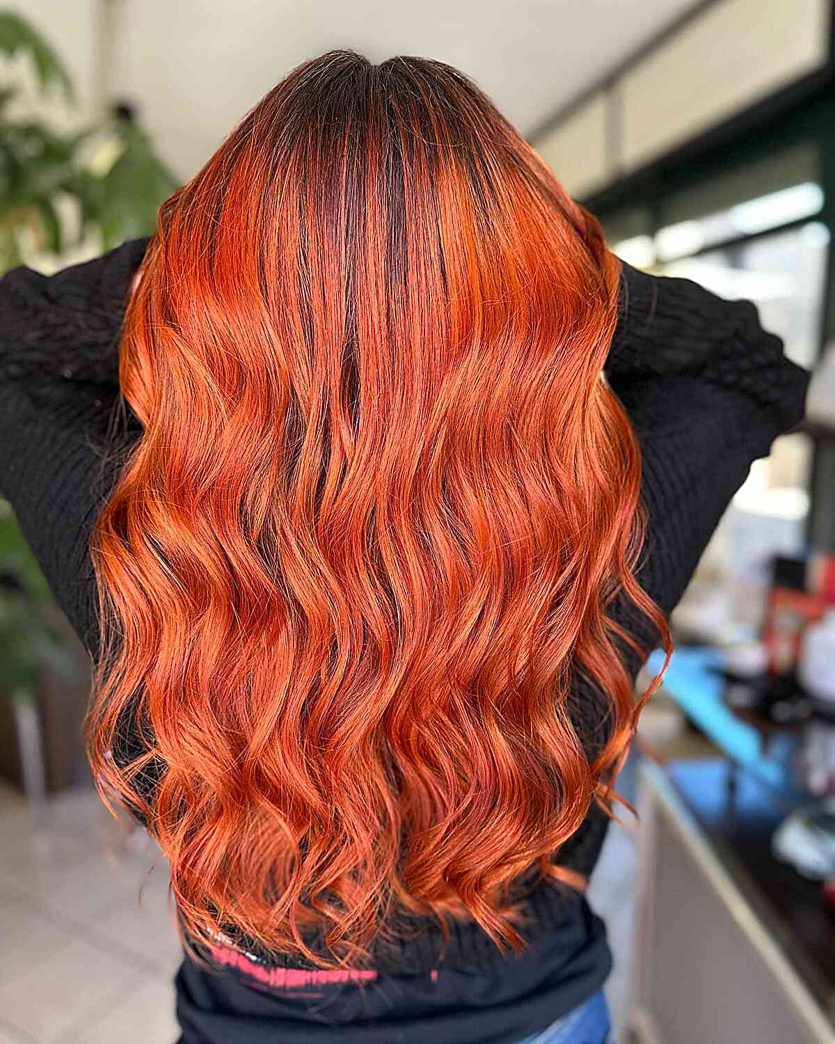 Wavy Hair Colored in A Bright Orangish-Red