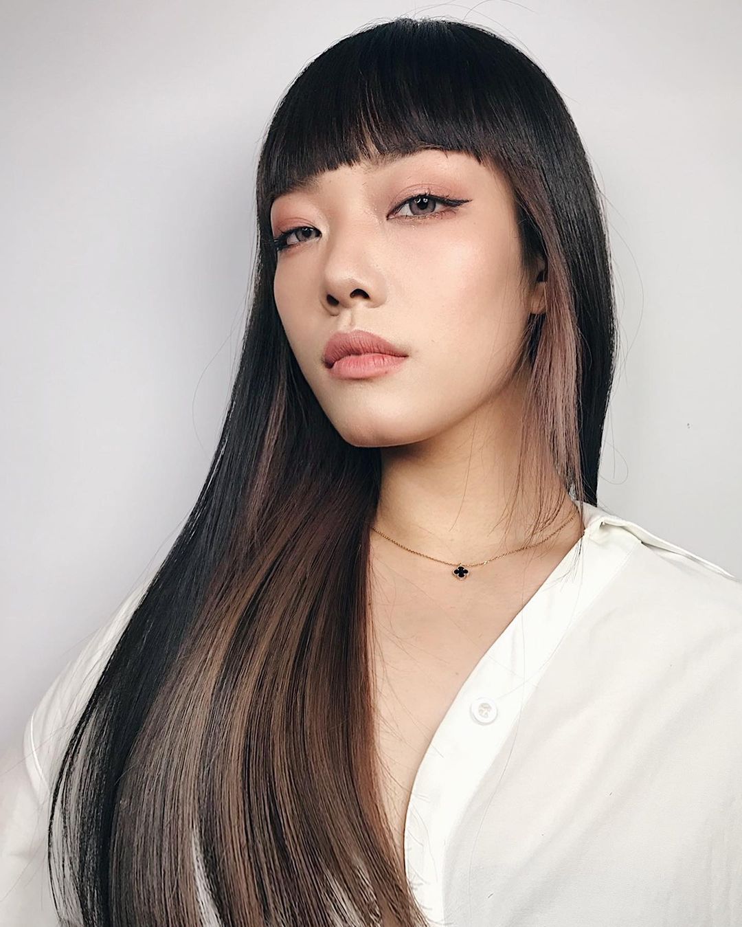 Long Straight Locks with Eyebrow-Skimming Bangs