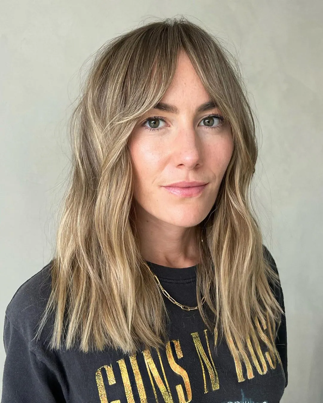 10-mid-length-dishwater-blonde-cut-with-curtain-bangs