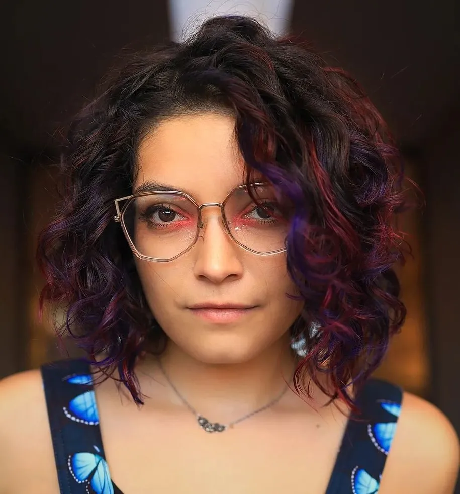 purple-and-red-highlights-in-short-dark-curly-hair