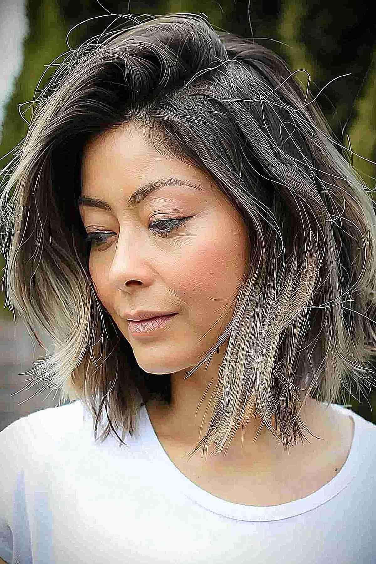 Shaggy bob with a deep side part