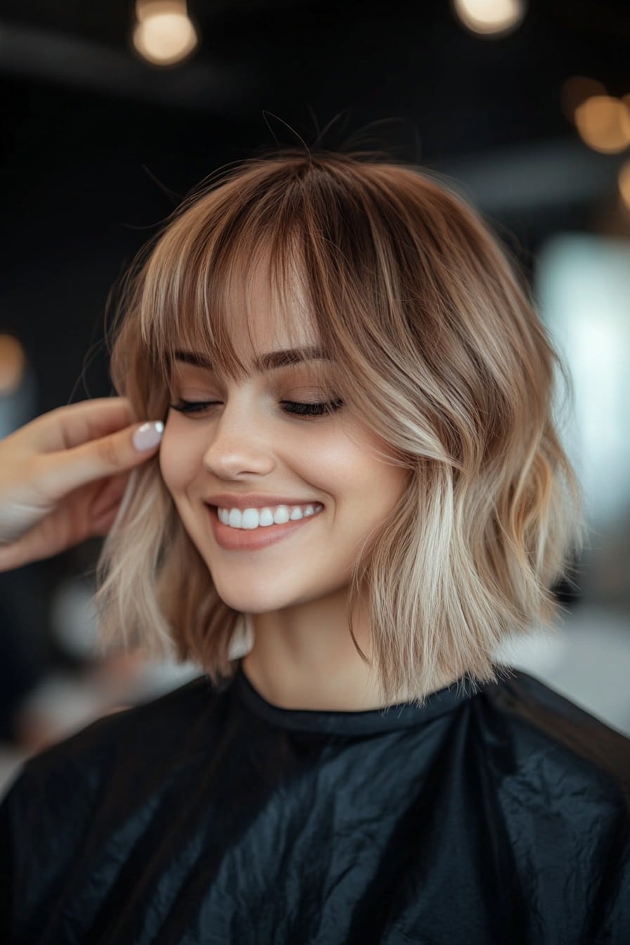 Dimensional Blonde Balayage with Wispy Bangs