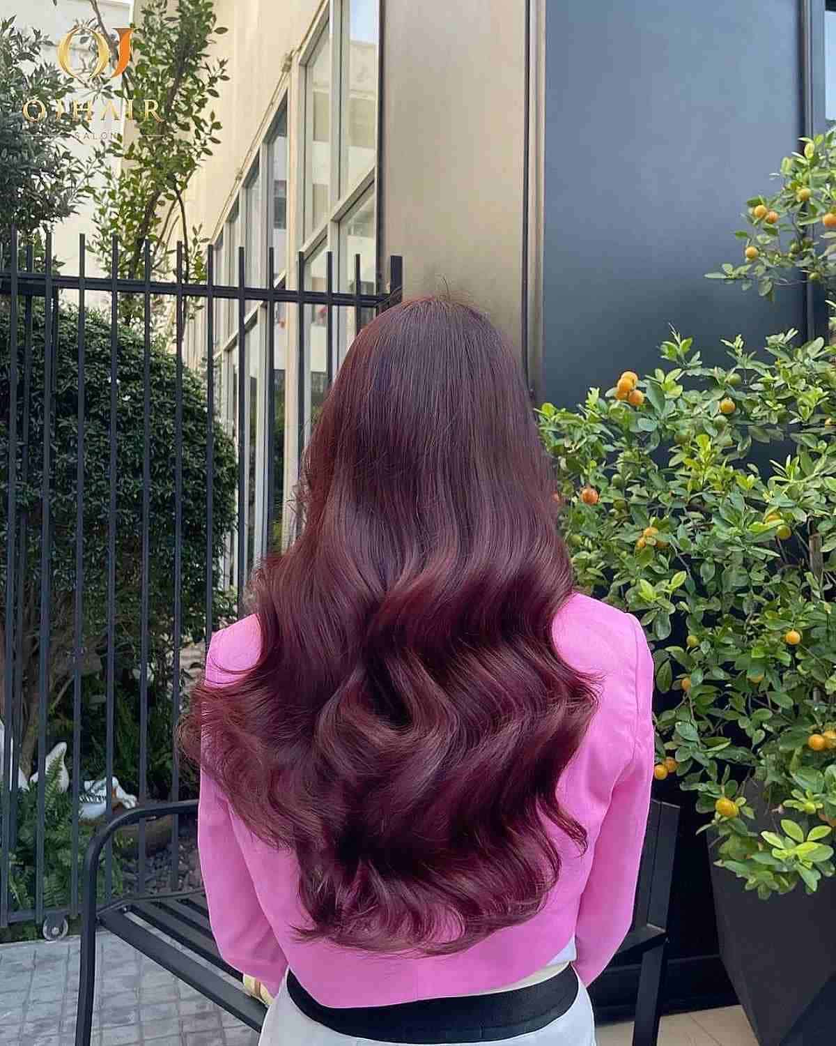 Burgundy Long Hair with Subtle Layers and Bouncy Waves