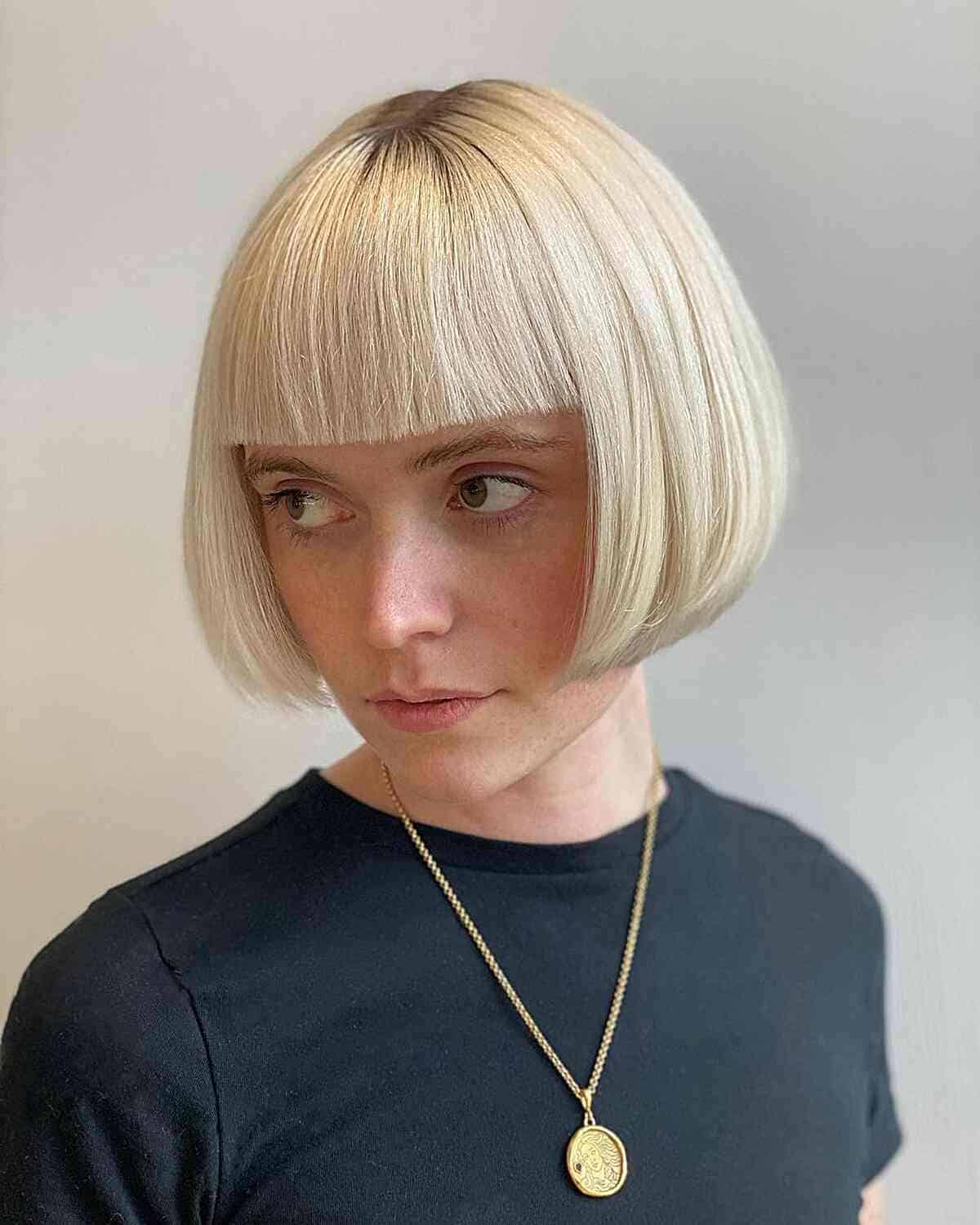 Jaw-Length Sharp Edges on a Bob with Bangs for women with thick blonde hair