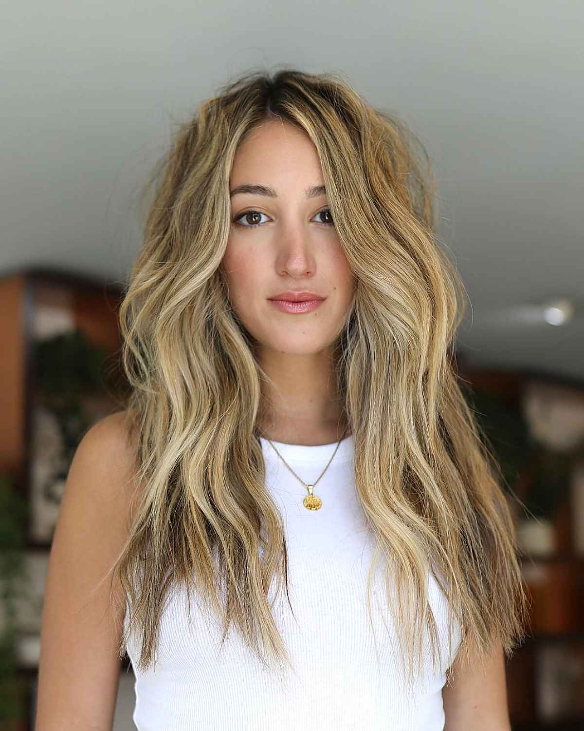 28 Long Blonde Hair Styles That Are Taking Over in 2025 beige blonde with long wavy hair