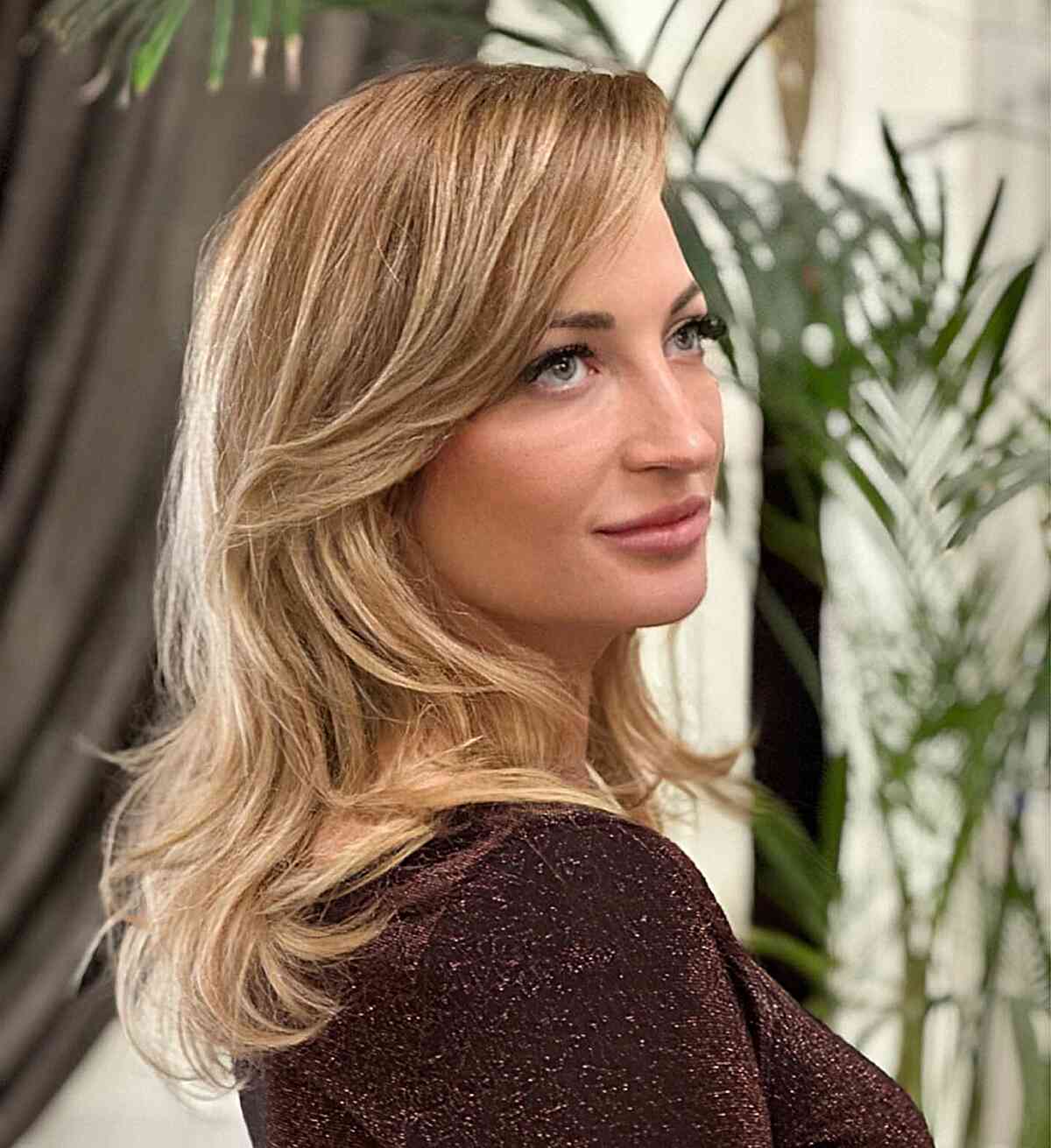 28 Long Blonde Hair Styles That Are Taking Over in 2025 Long Side-Swept Bangs Style for Blondes